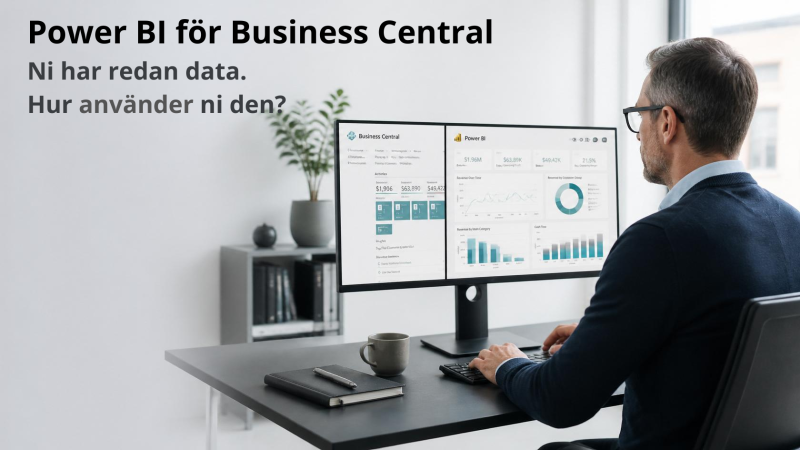 Ekonomichef framför skärm med Power BI-dashboard baserad på data från Business Central.